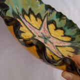 Multicolored earthenware dish signed Yvon Roy
