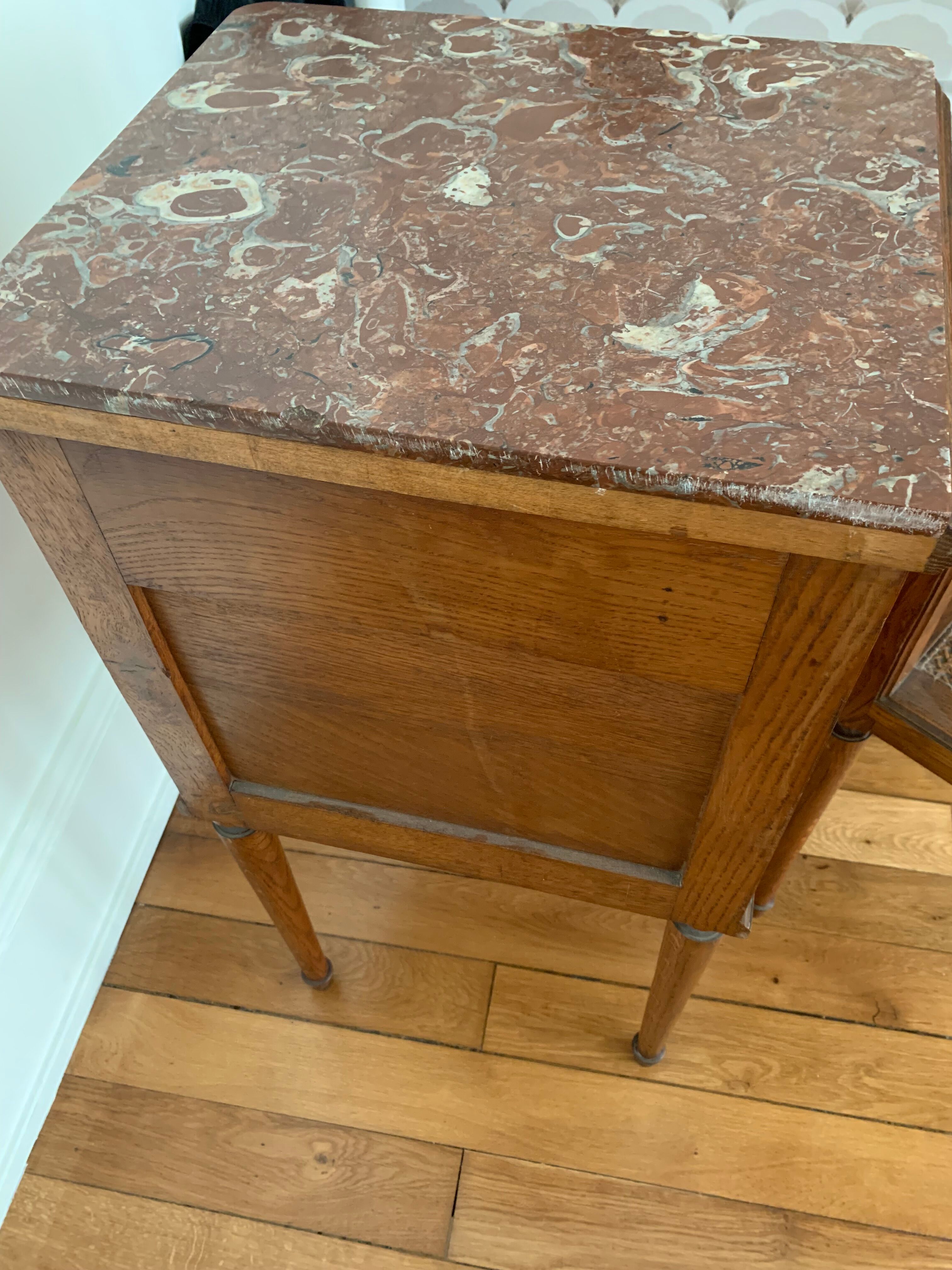 Pair of high marble and walnut bedside tables