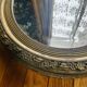 Large antique oval mirror