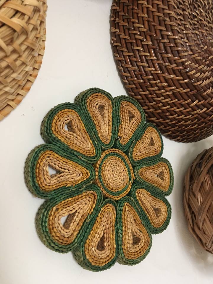 Wall composition of seven baskets and wicker trays.