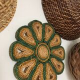 Wall composition of seven baskets and wicker trays.