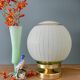 Lampe à poser globe vintage en verre granité vert et doré