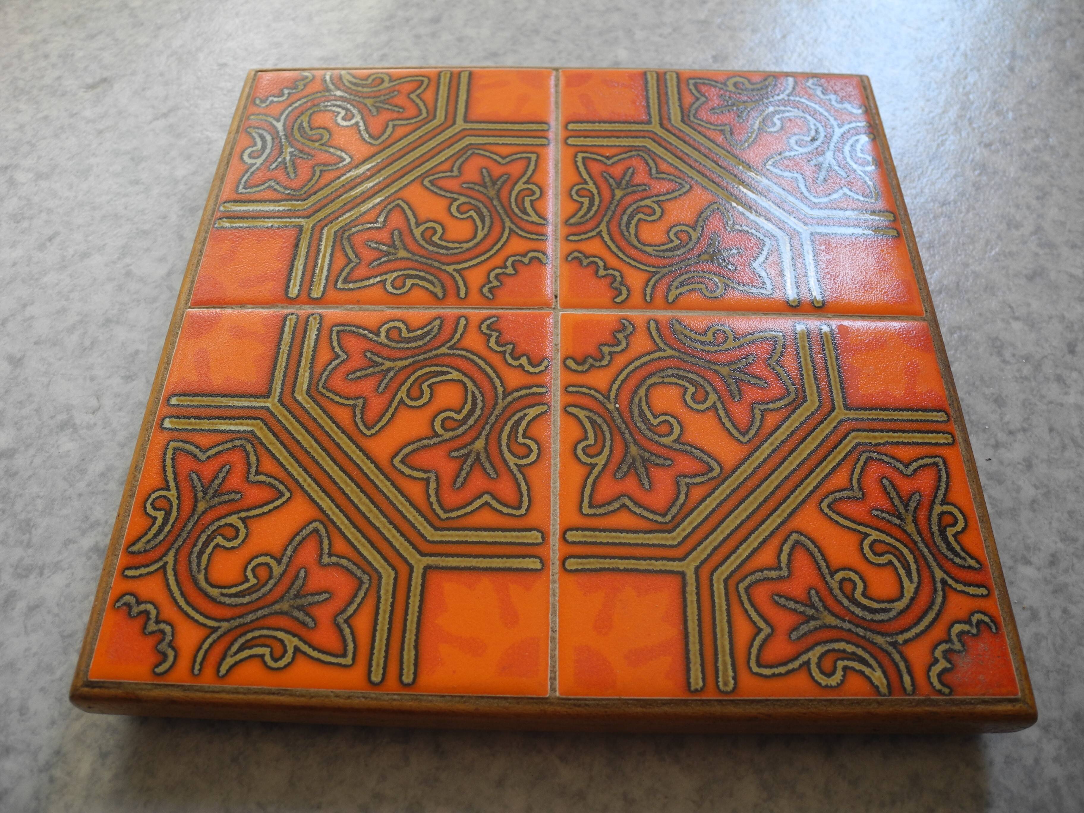 vintage orange ceramic trivet