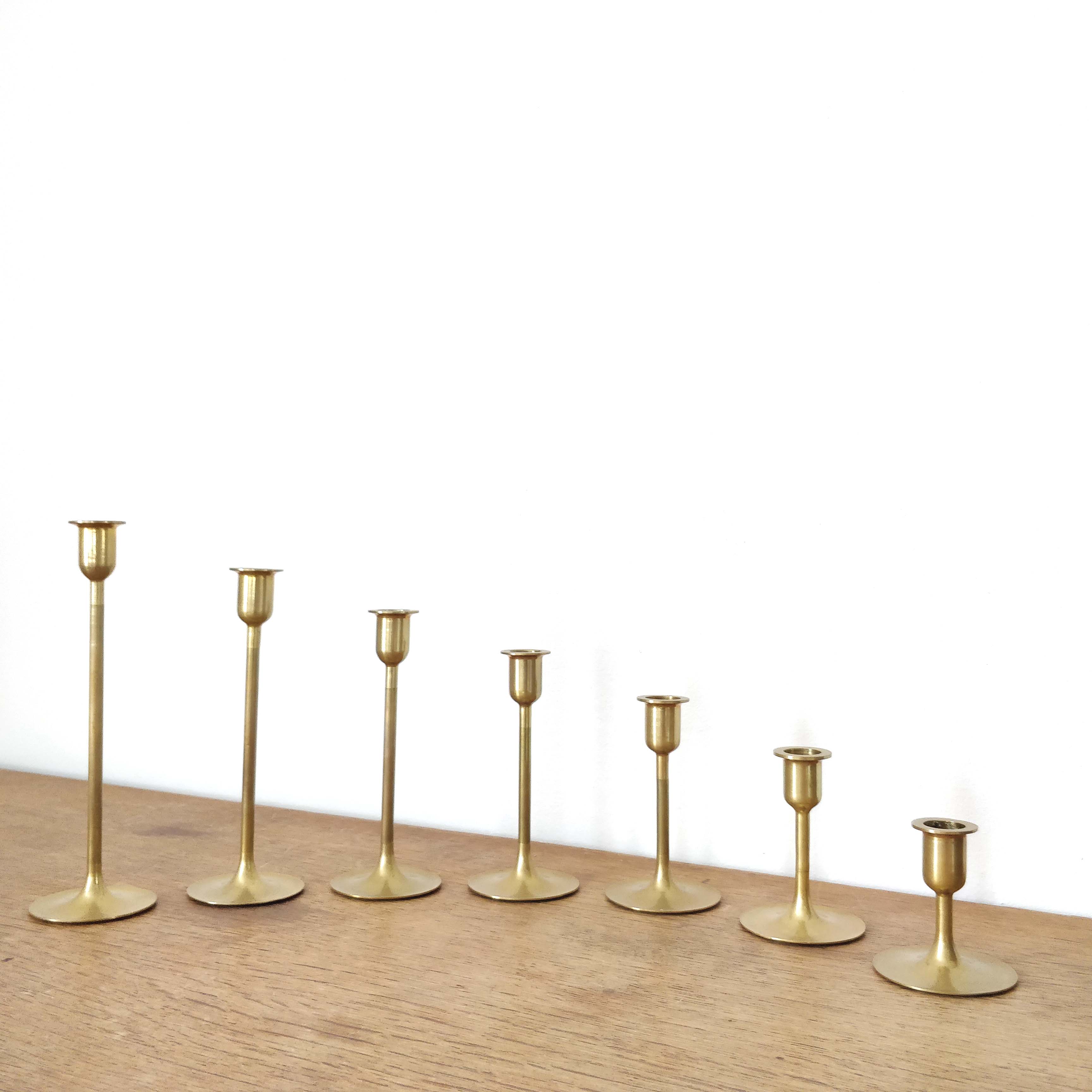 Set of 7 brass candlesticks