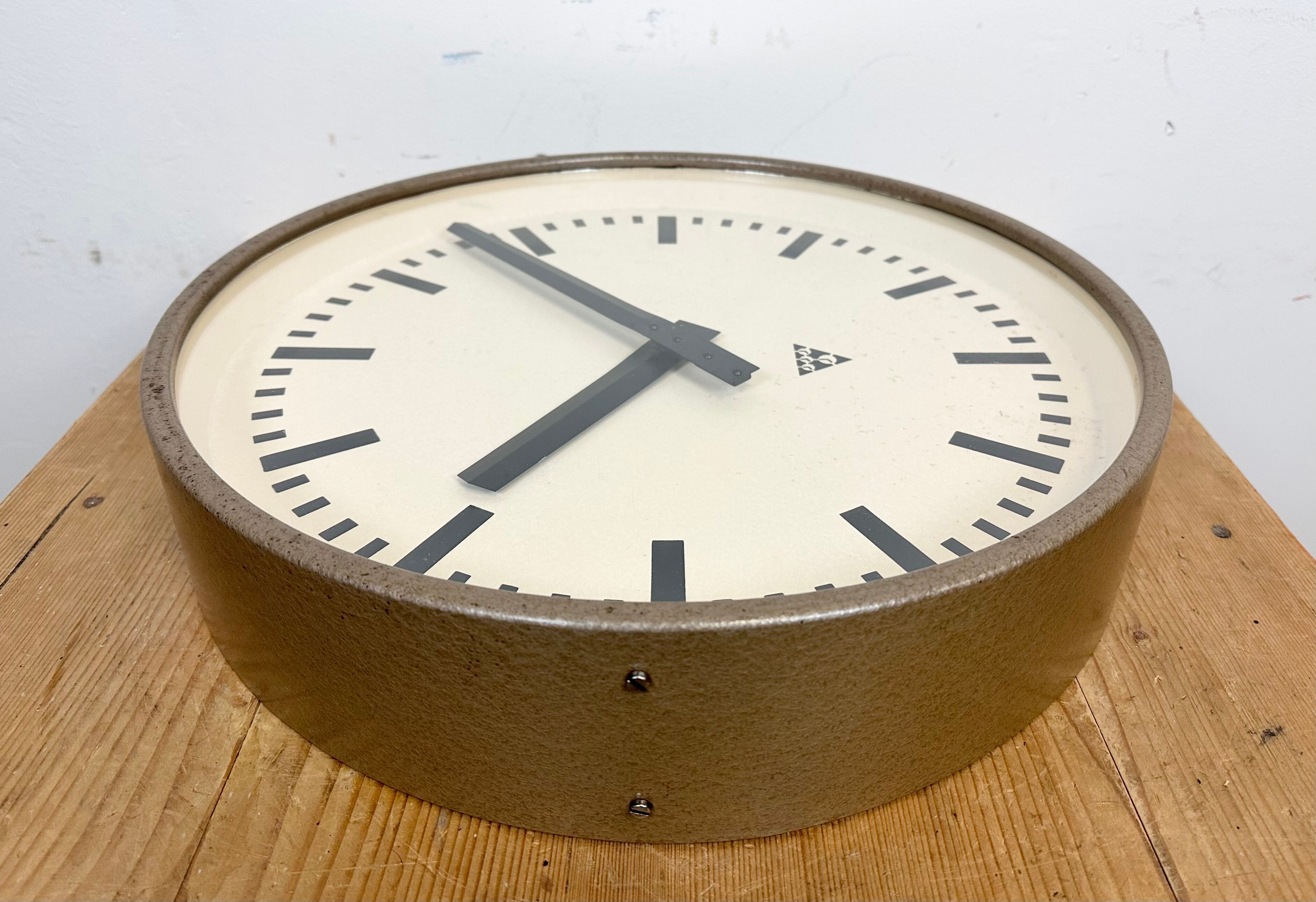 Brown industrial factory wall clock from Pragotron, 1960s