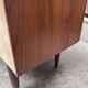 Teak sideboard with flap, 2 drawers and conical legs.