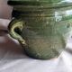 Glazed green terracotta pot.