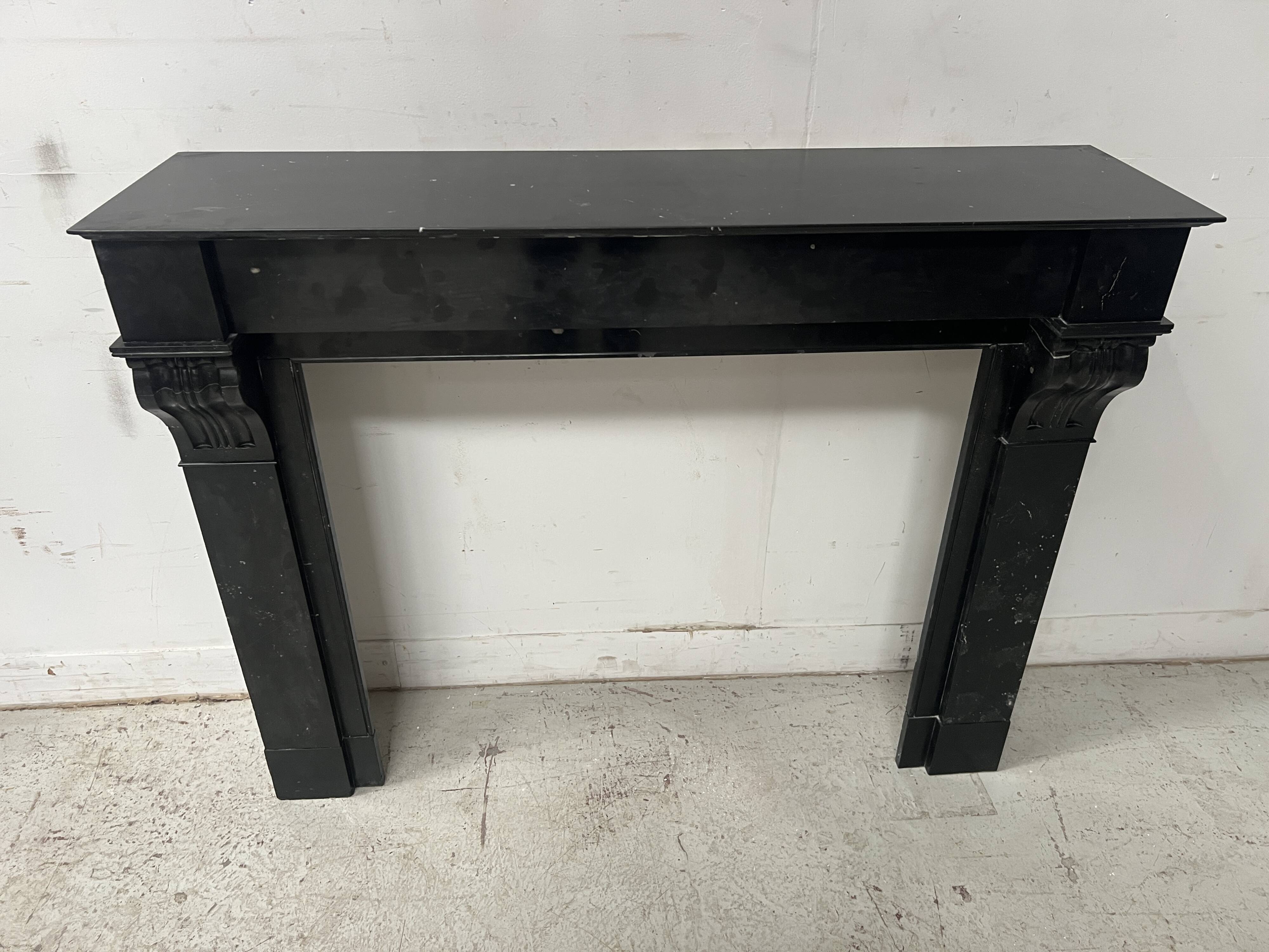 Napoleon III period fireplace with a black marble corbel. 19th century.