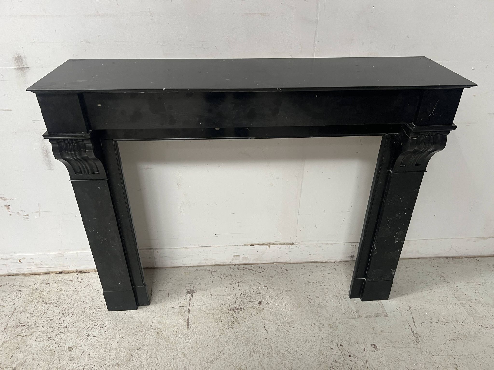 Napoleon III period fireplace with a black marble corbel. 19th century.