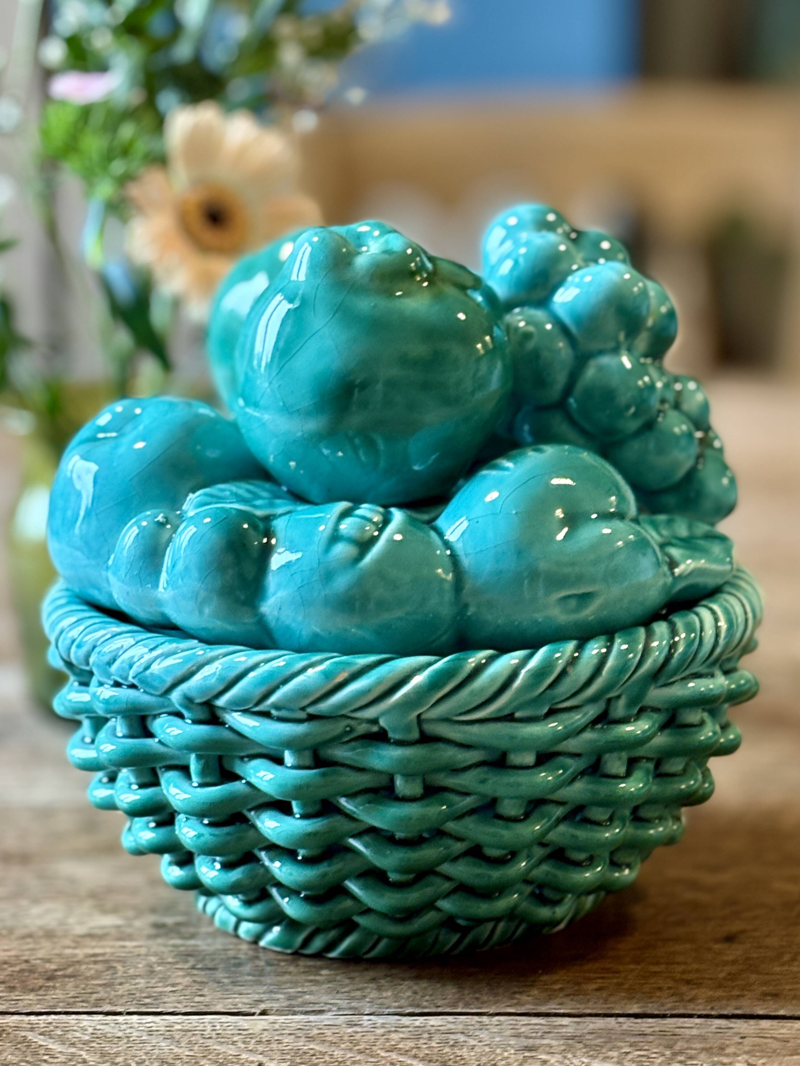 Vintage green earthenware plate/basket with fruit decorations.