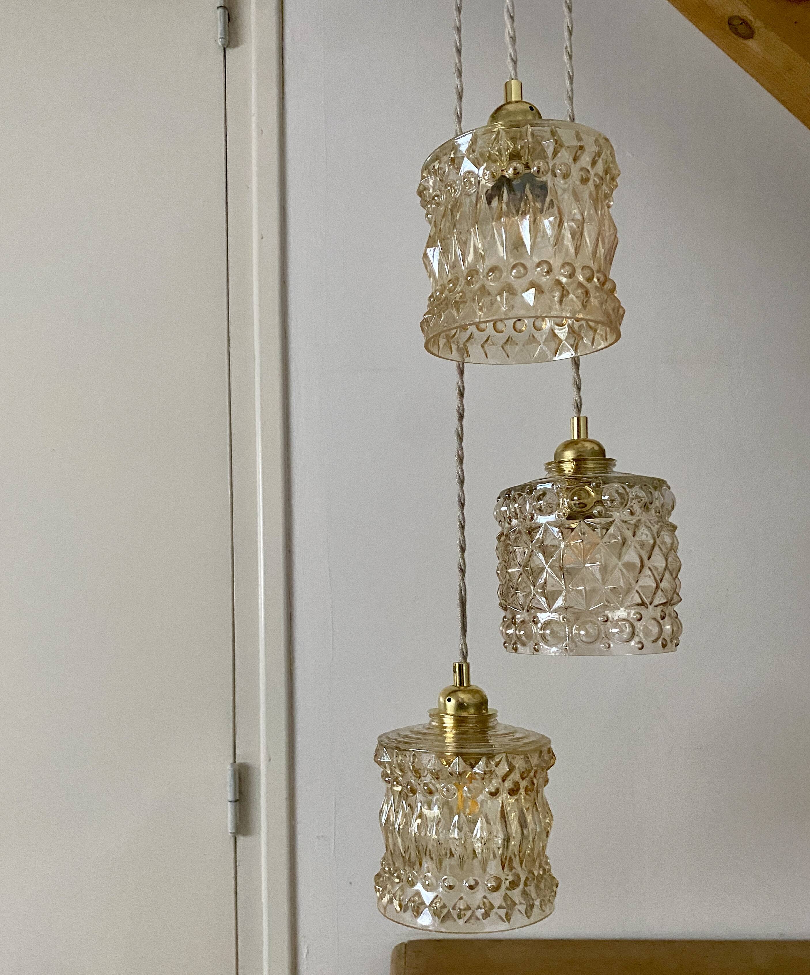 Triple antique globe pendant light in amber glass