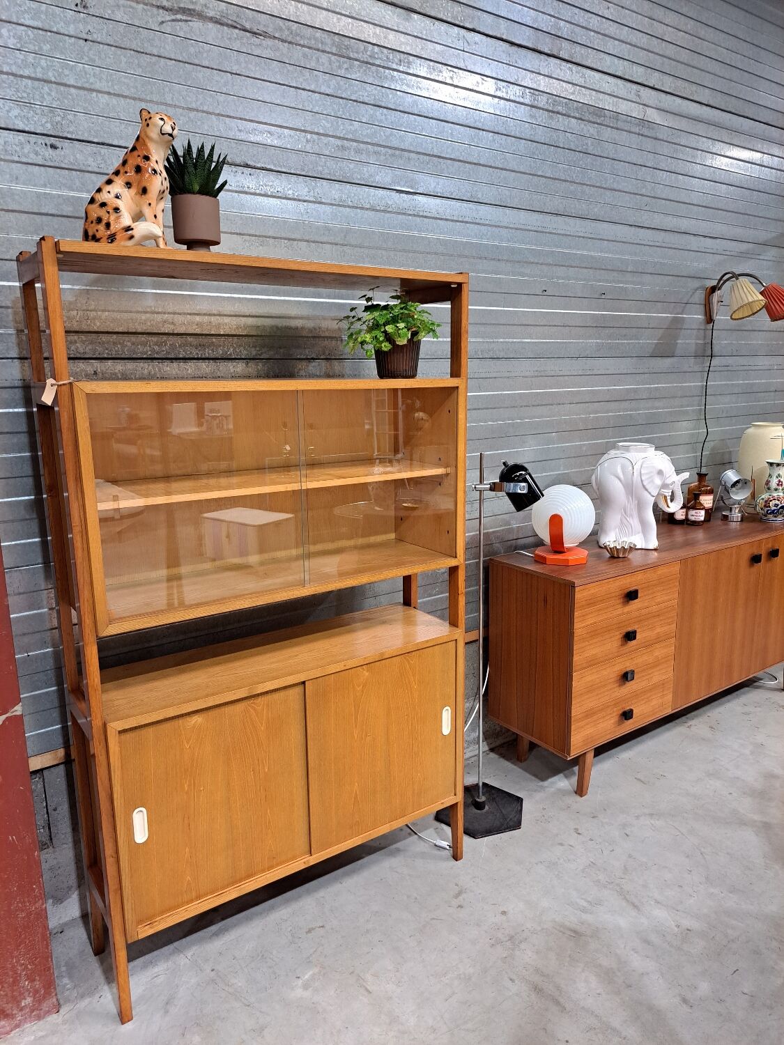 Vintage wooden showcase with sliding doors and white handles