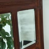 Antique beveled mirror on a wooden frame, 1930