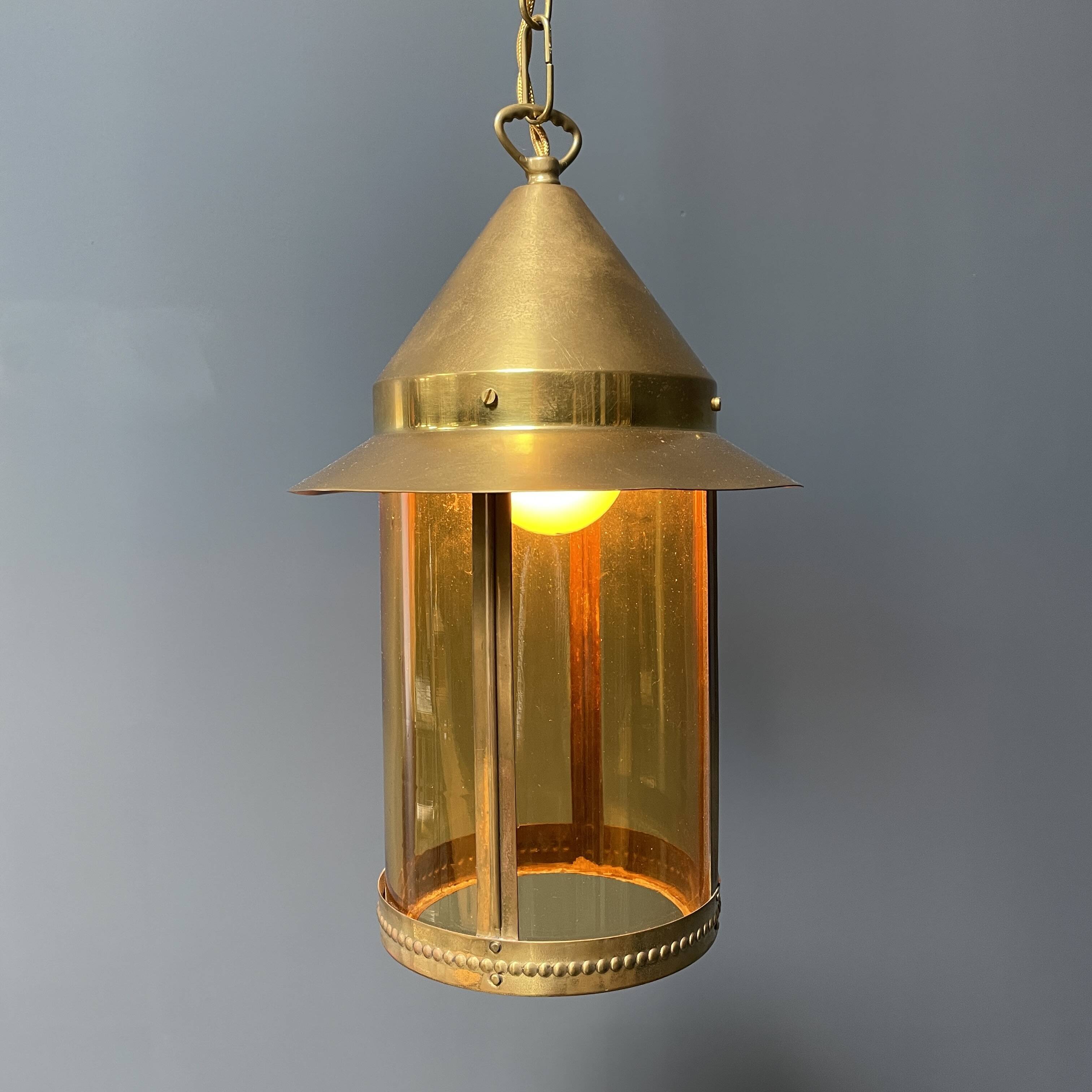 Brass lantern pendant lamp with yellow glass