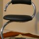 Cobra chairs in steel and black leather by Giotto Stoppino, 1970s, set of 5.