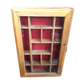 Old hanging display case with 15 wooden boxes, red background + vintage glass door