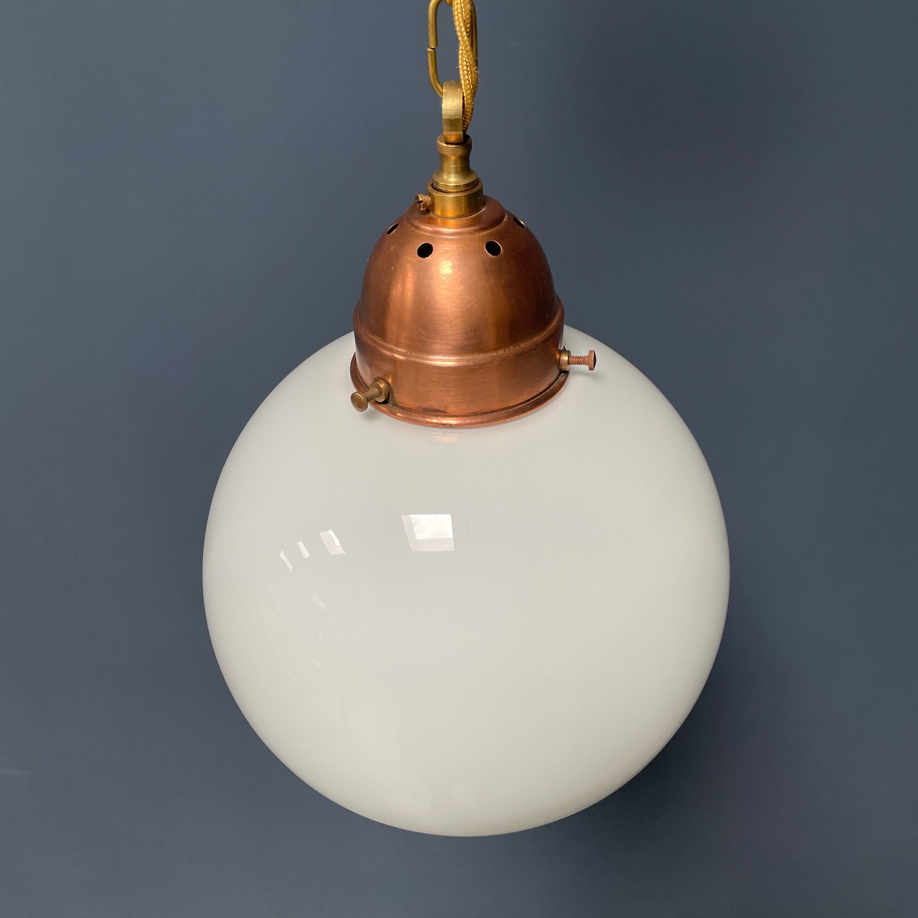 Opaline glass ball hanging lamp with copper fixture