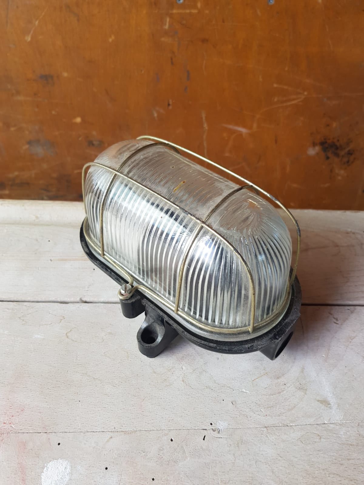 Antique exterior wall light moulded glass & metal grille & black bakelite support