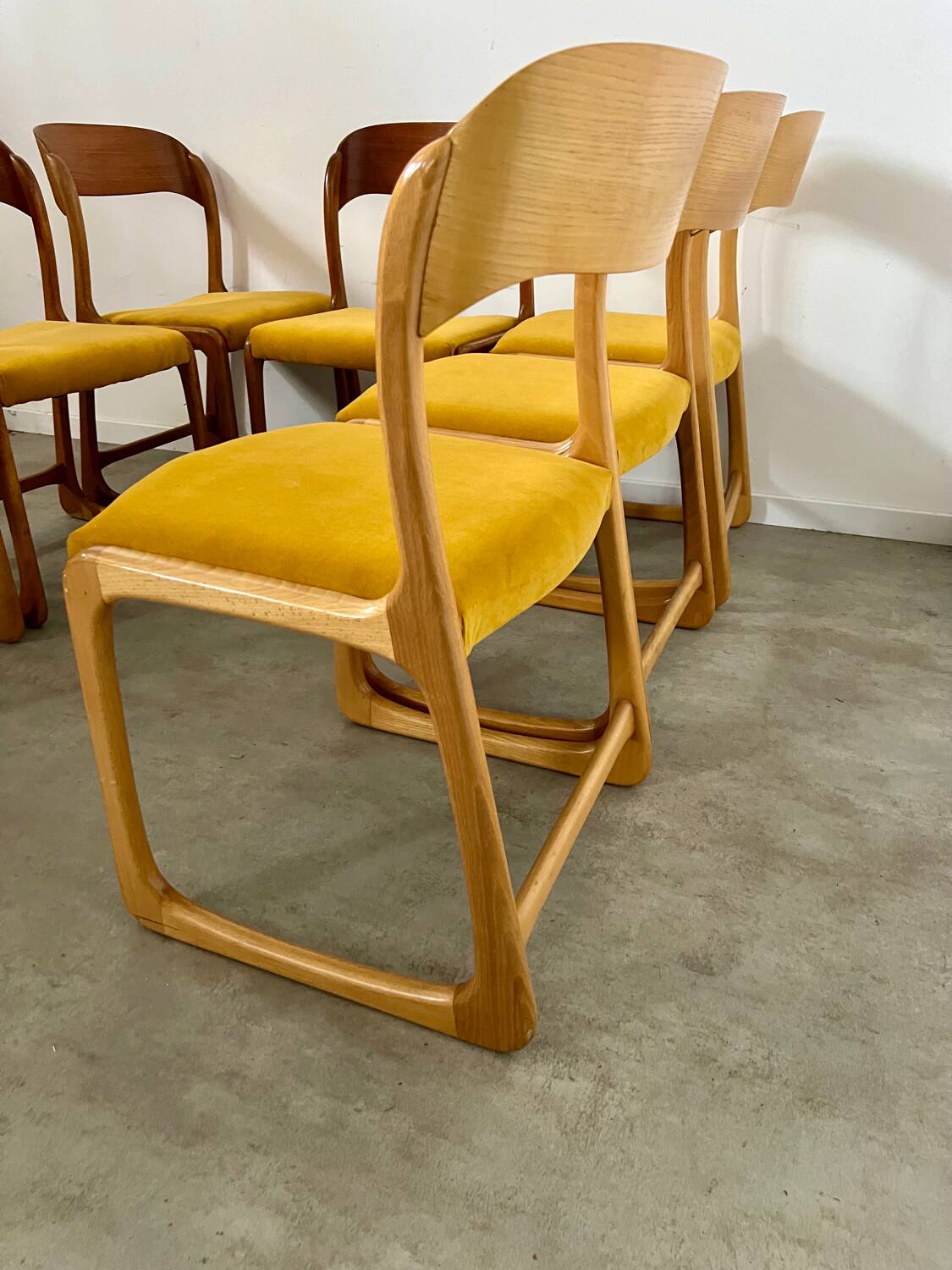 Set of 7 Baumann sled chairs in wood and mustard yellow fabric, 1960s