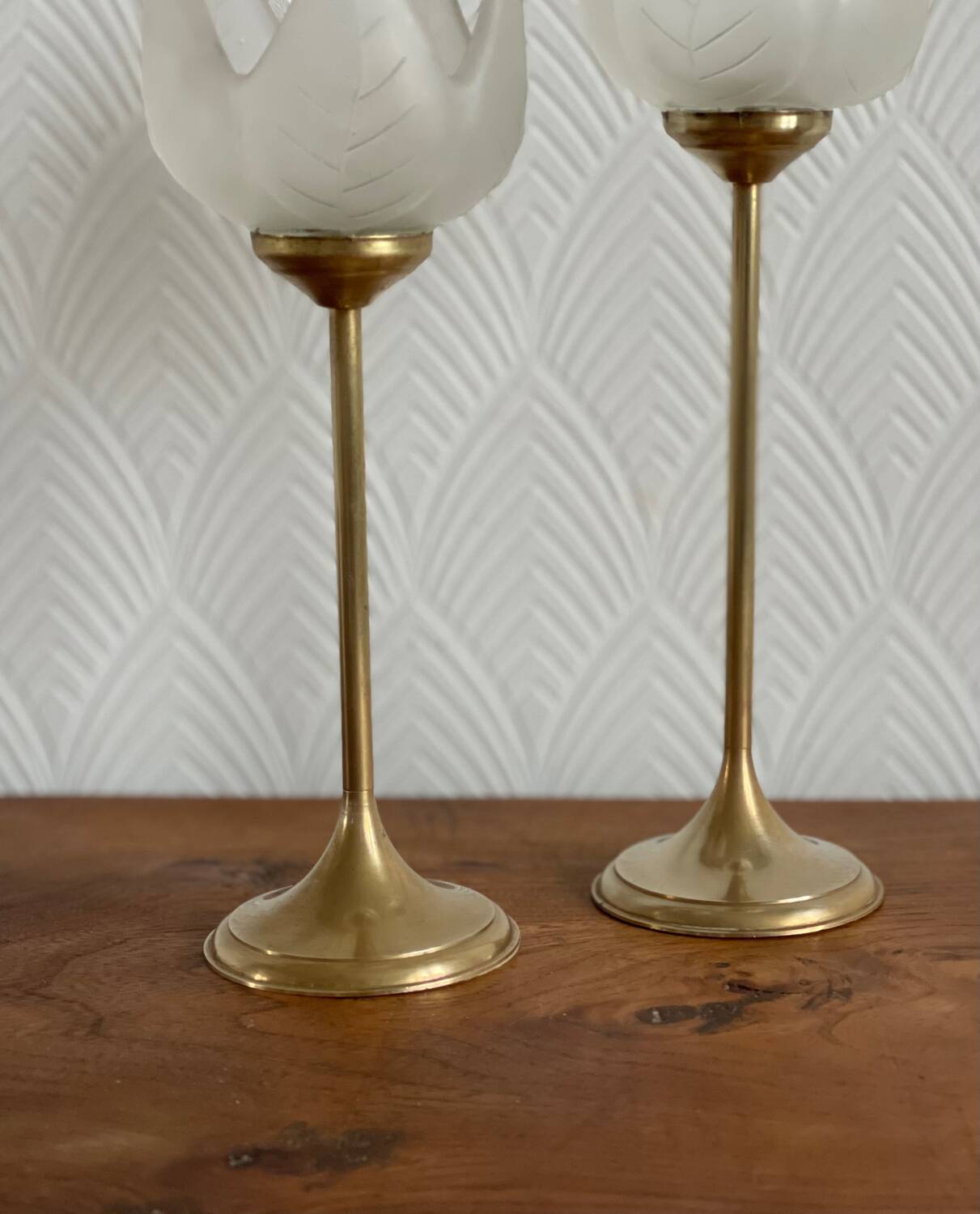 Pair of tulip-shaped candle holders in frosted glass and brass.