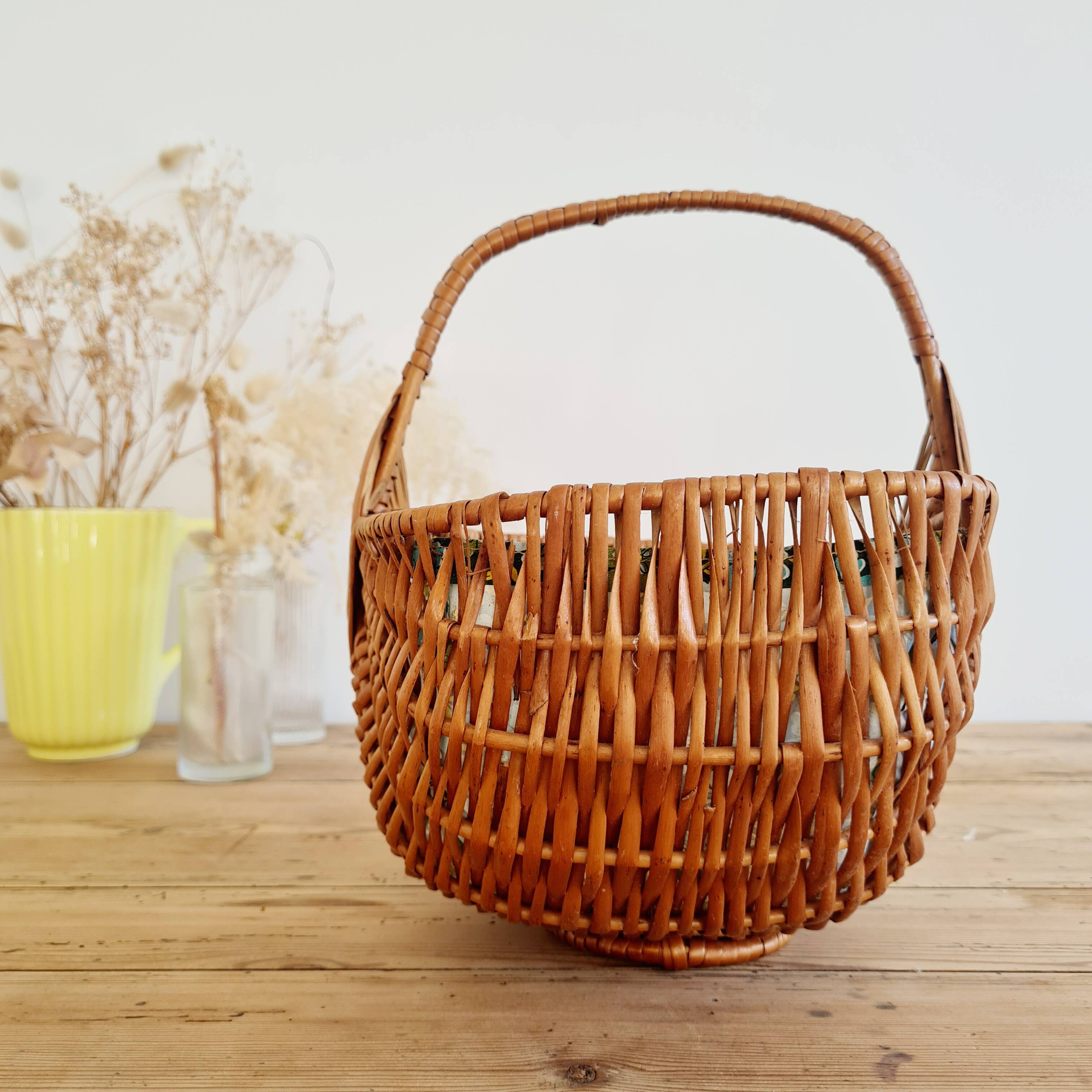 Small old basket with floral fabric interior