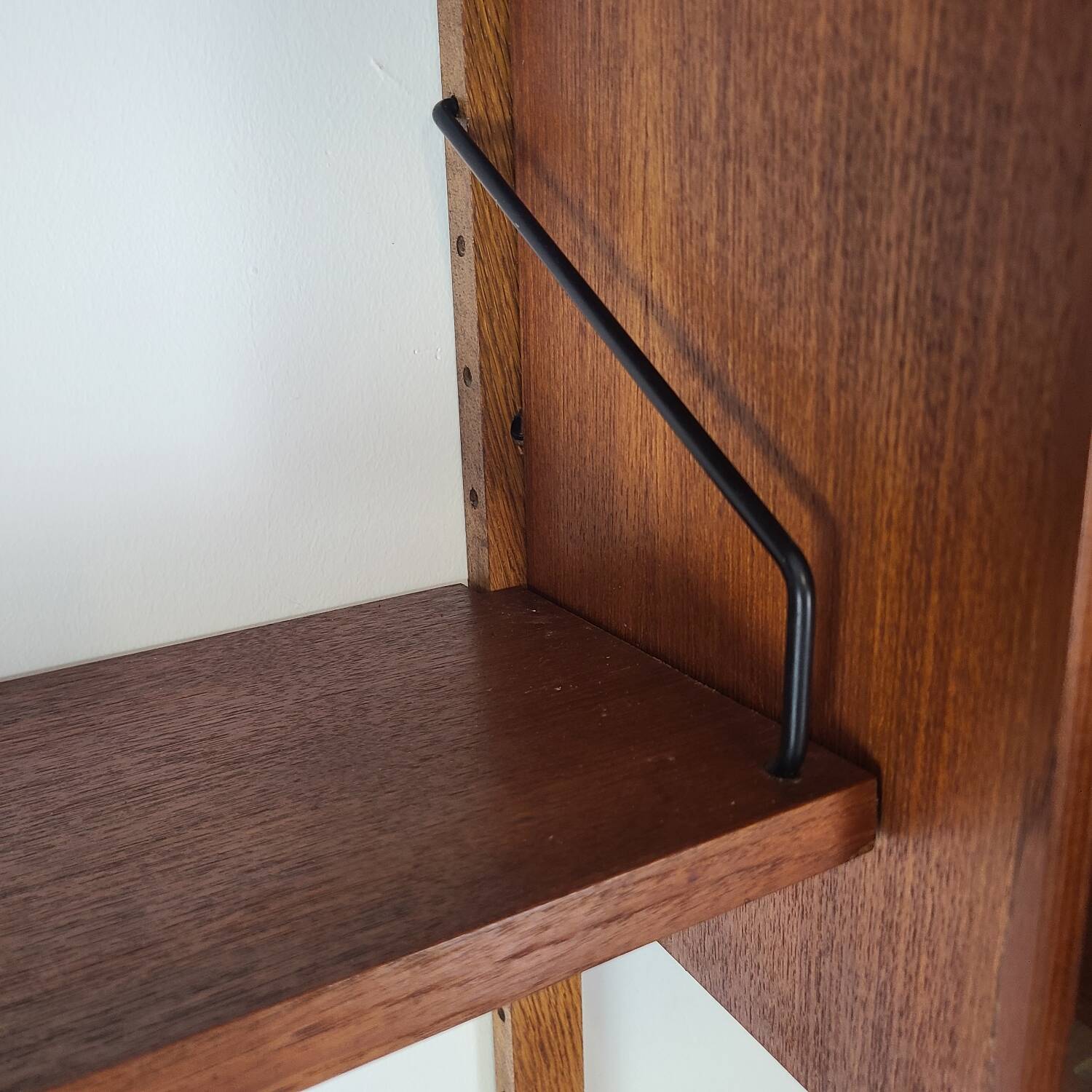 Danish wall-mounted bookshelf designed by Poul Cadovius, Scandinavian design.