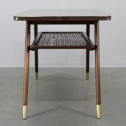 Mid-century German coffee table with rattan shelf and brass legs