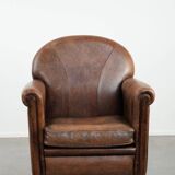 Beautiful vintage sheep leather armchair with a characterful appearance