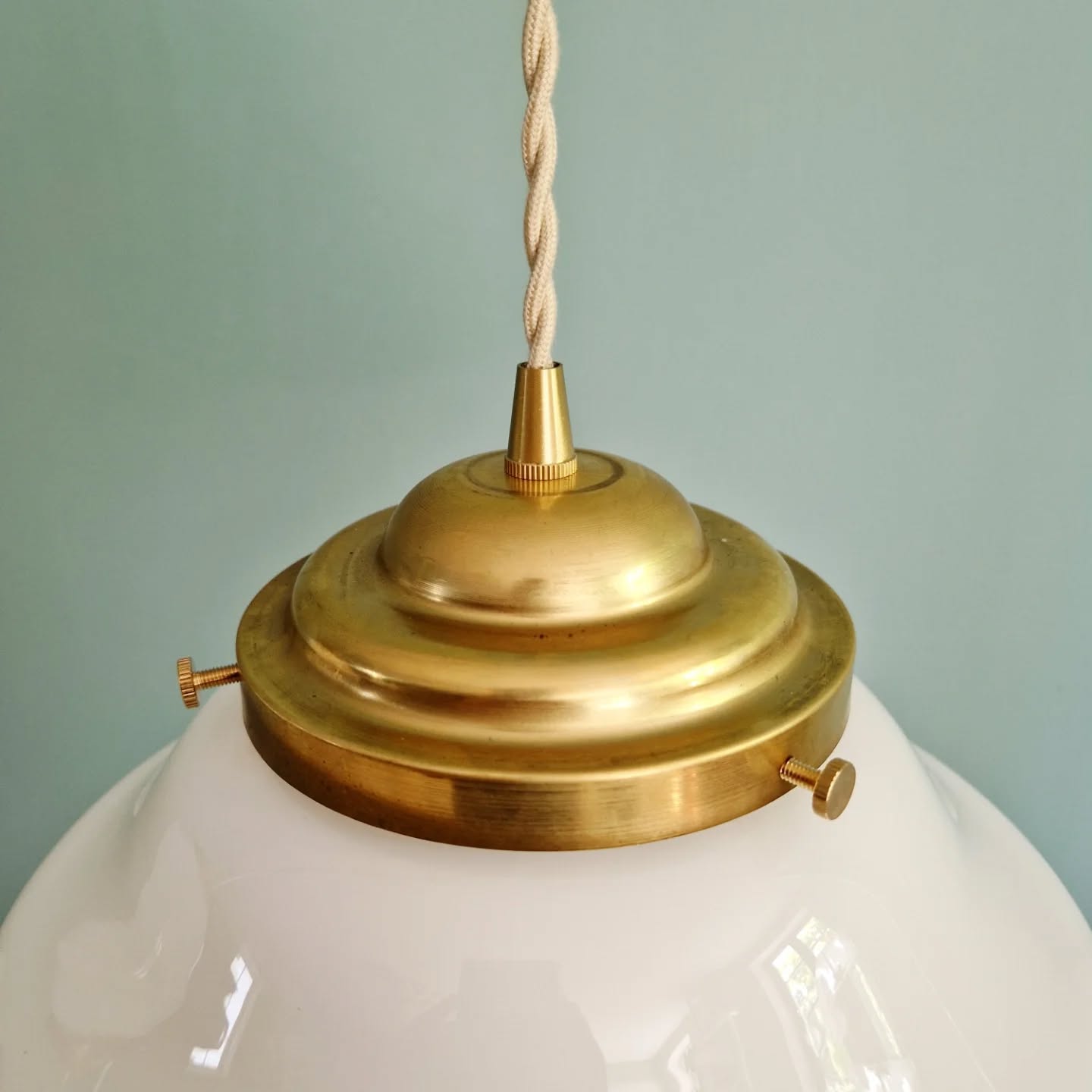 Pair of Art Deco pendant lights in white opaline.