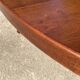 Baumann round oval extendable Scandinavian table in rosewood with 2 extensions.