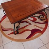 Coffee table in cherry wood with a wrought iron base.
