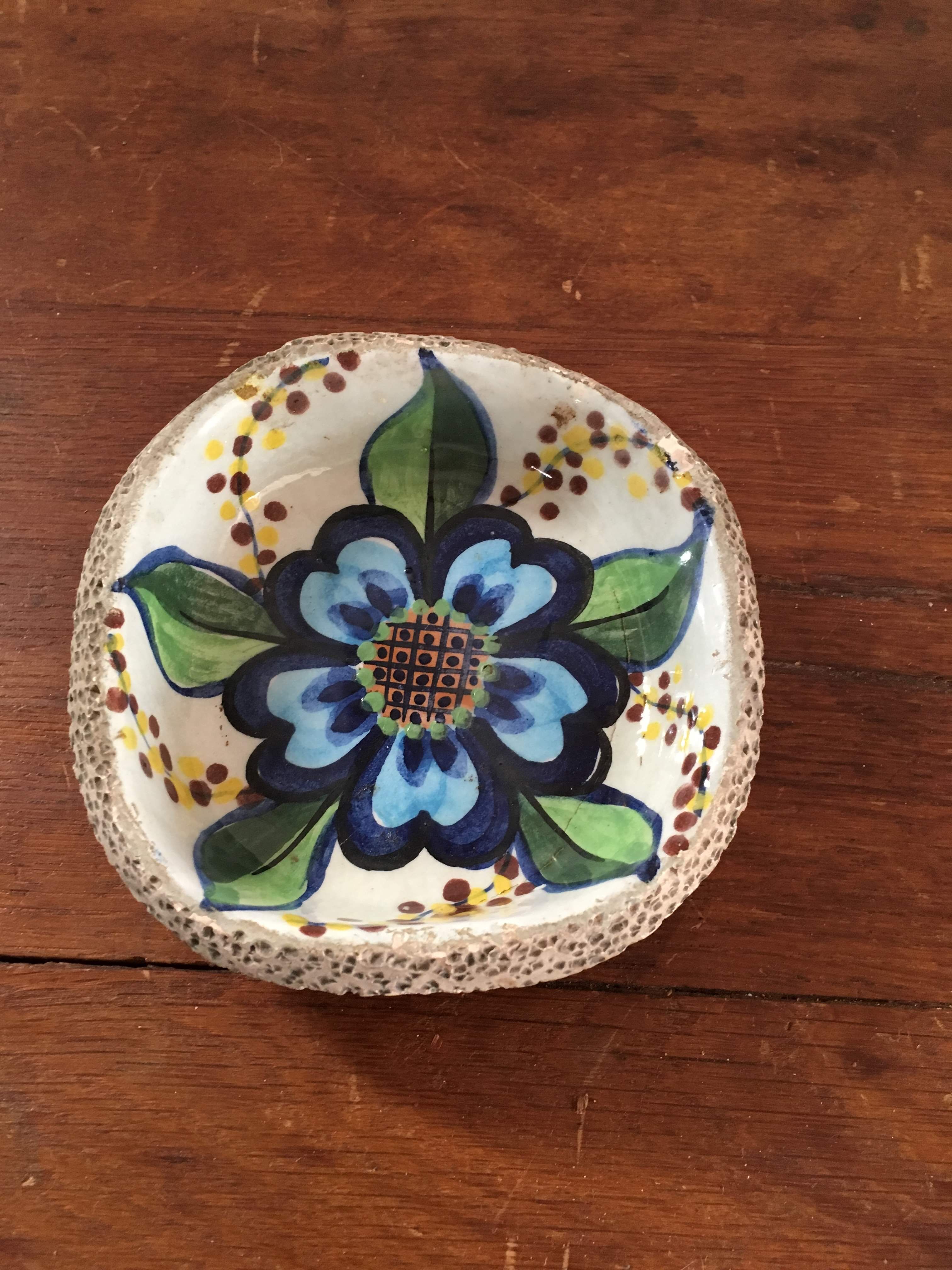 Cup lava foam with blue flower.