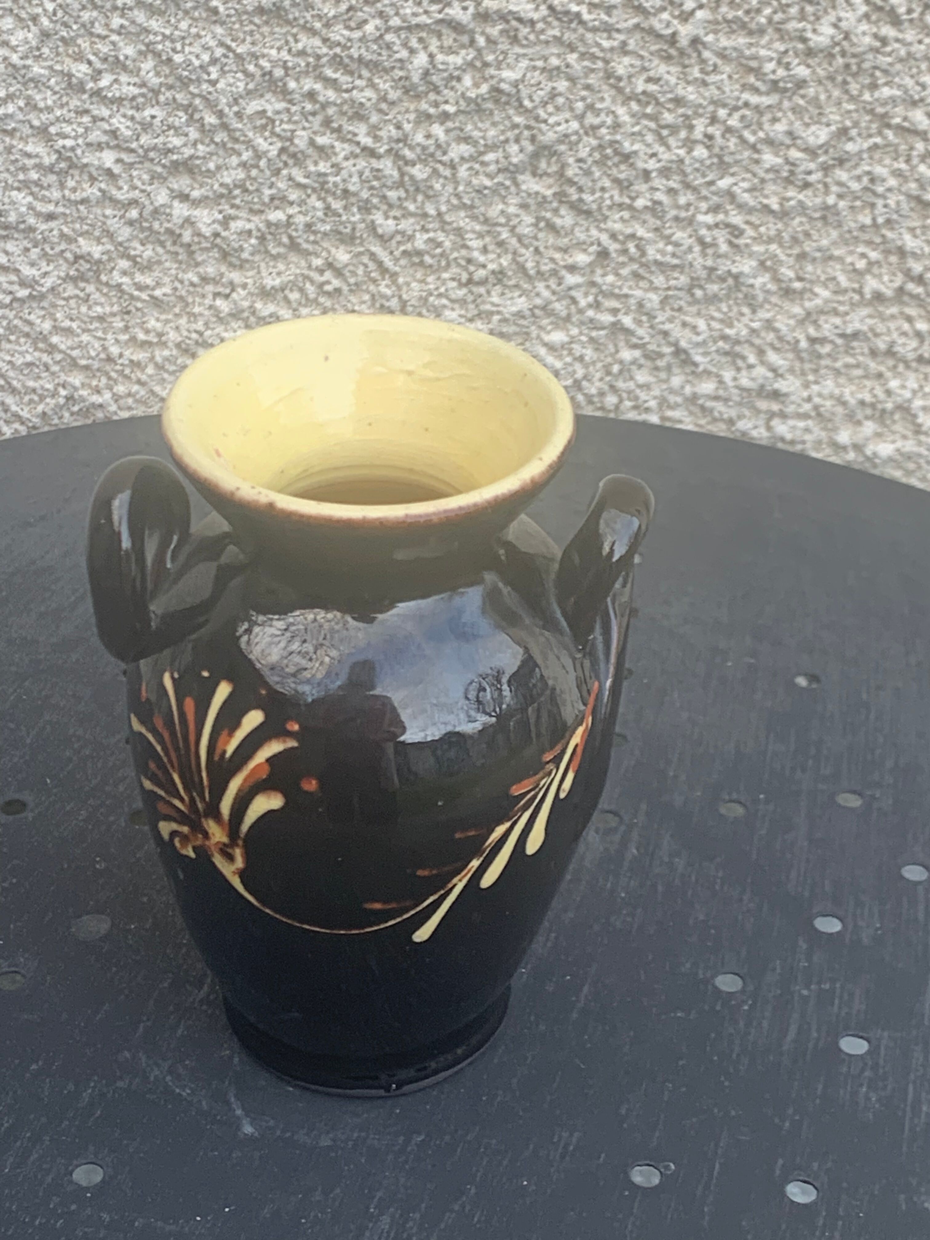 Vintage hand-painted yellow and black glazed ceramic amphora vase