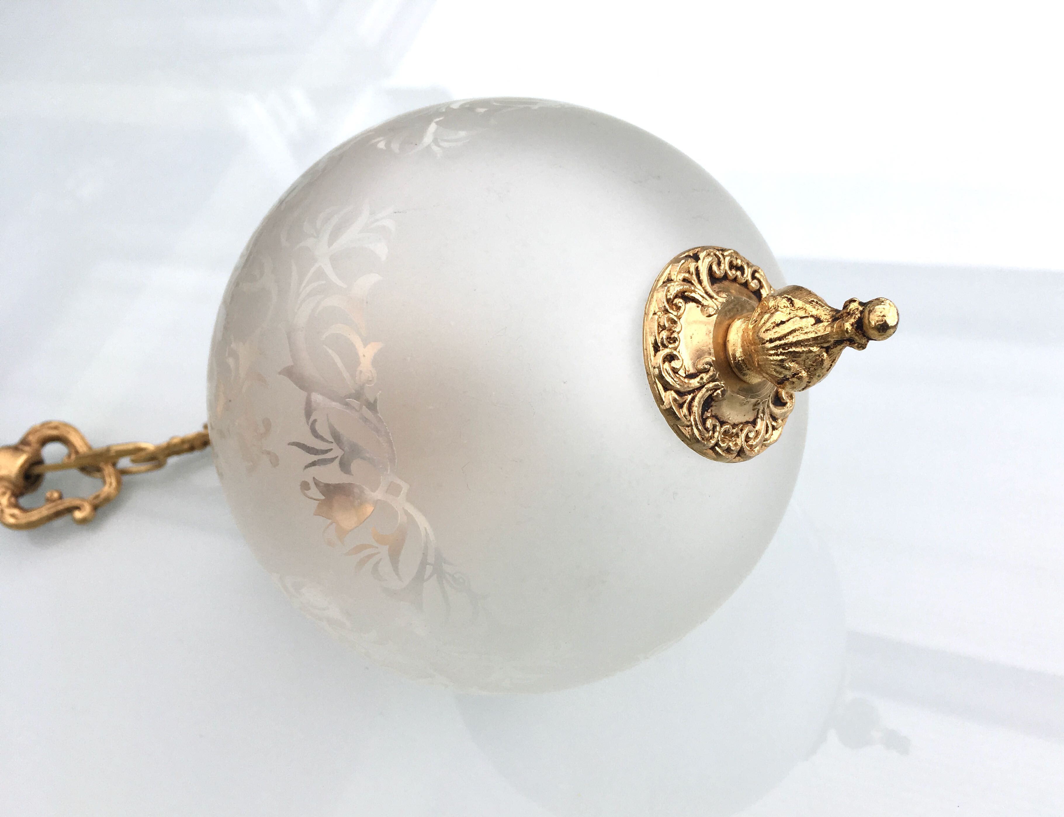 Floral globe and gold metal hanging lamp