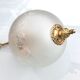 Floral globe and gold metal hanging lamp