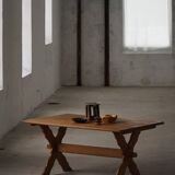 Solid oak dining table with cross base by Danish cabinetmaker, mid-20th century.