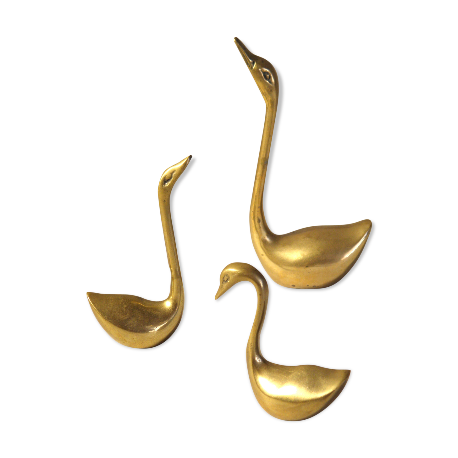 Trio of brass swans