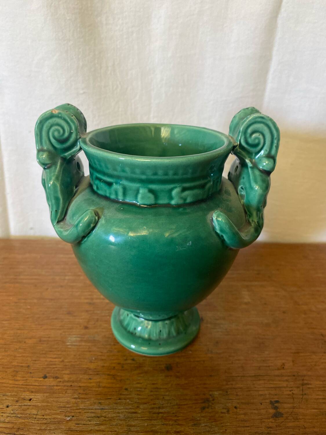 Antique green ceramic vase with handles