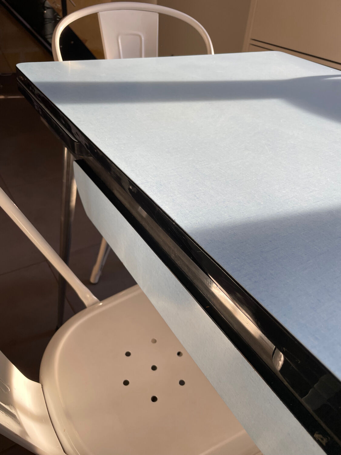 Blue Formica table for 4 to 6 people