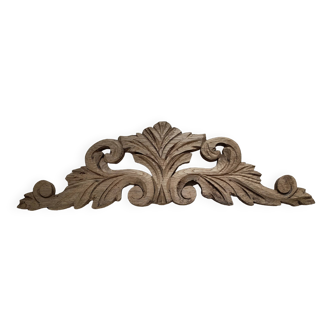 Old pediment in cut wood