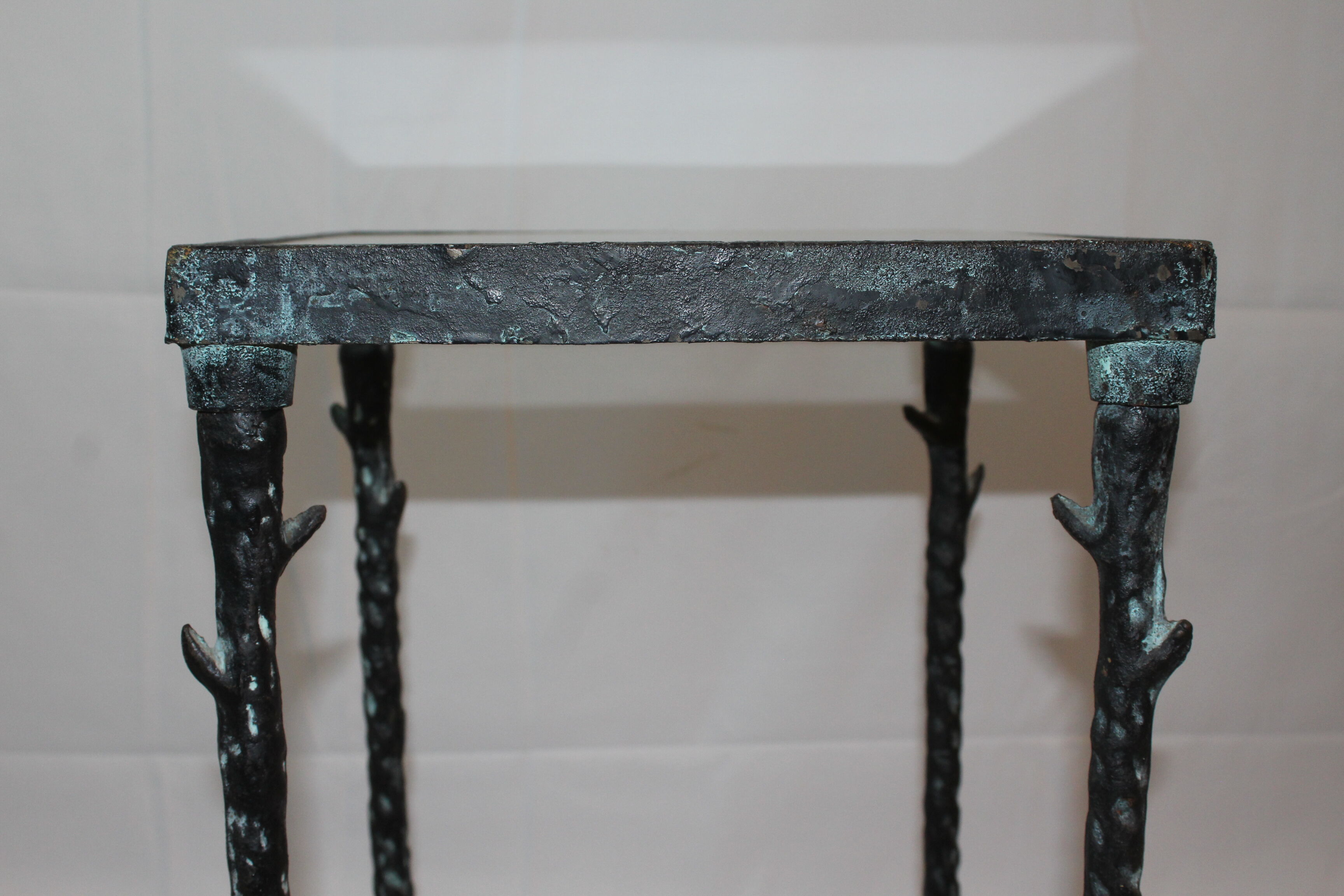 Giacometti style cast iron table, glass table