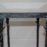 Giacometti style cast iron table, glass table