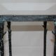Giacometti style cast iron table, glass table