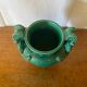 Antique green ceramic vase with handles