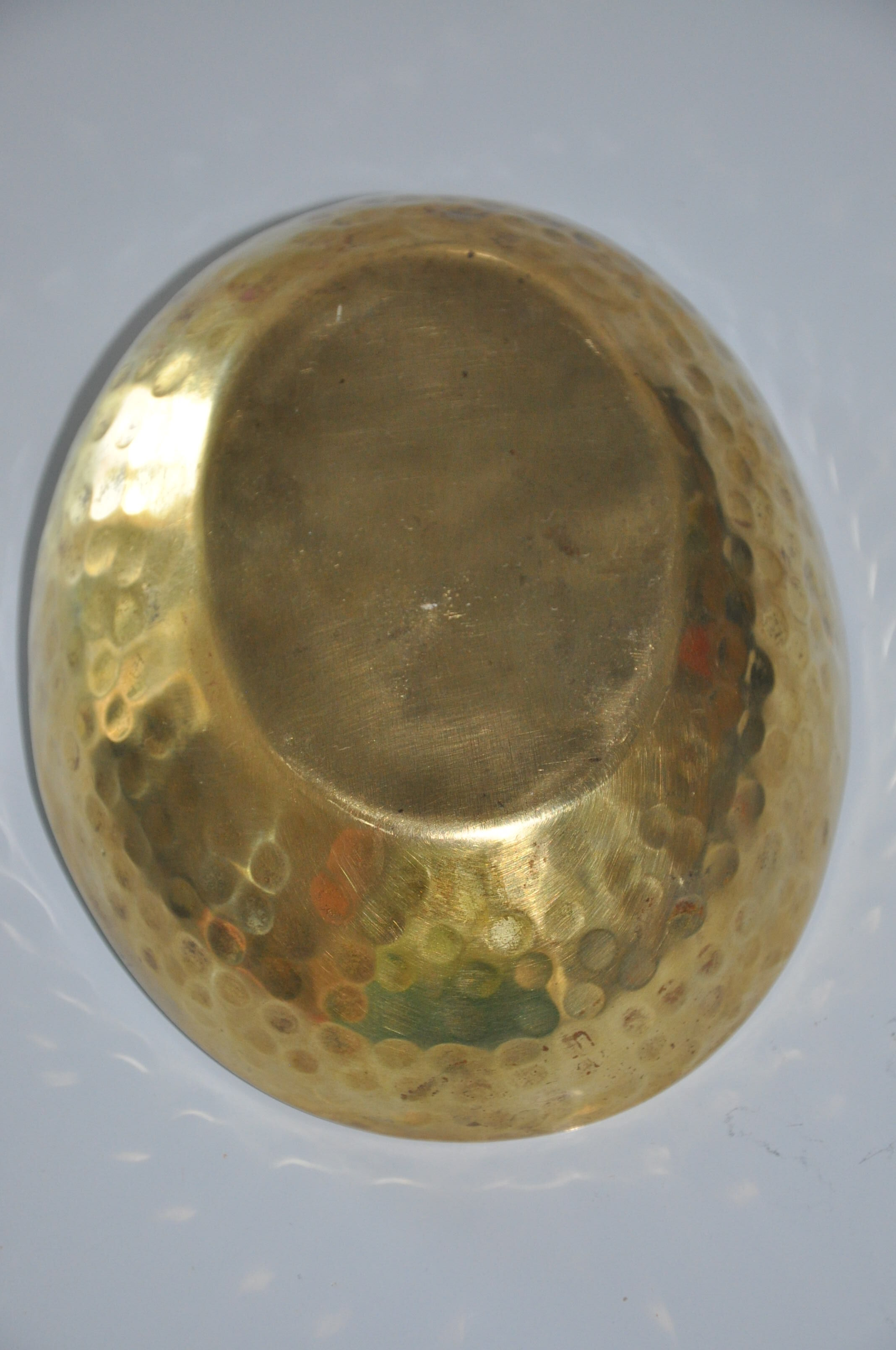 Empty hammered brass pocket