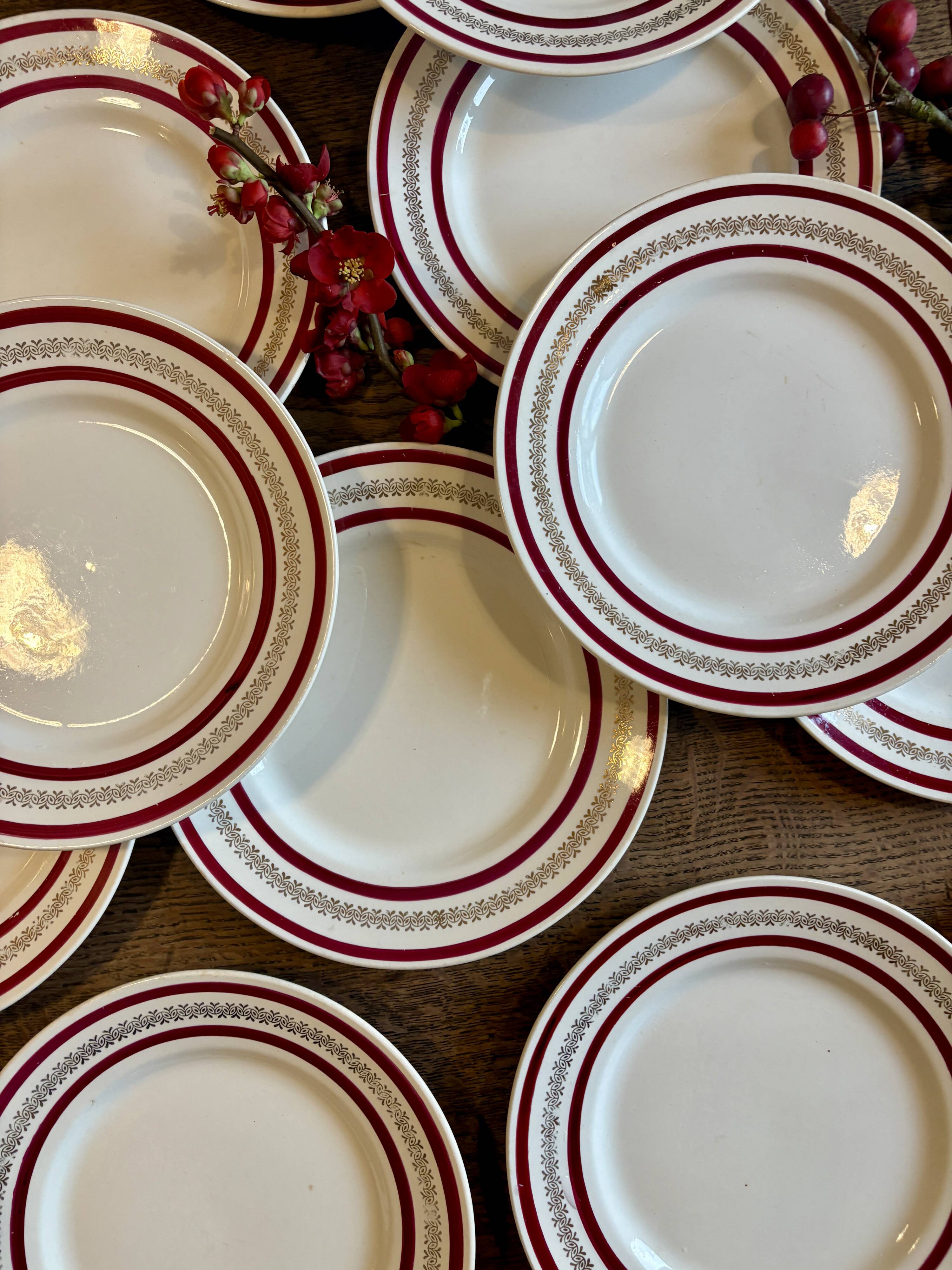 Set of 12 antique Gien red and gold dinner plates.