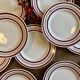 Set of 12 antique Gien red and gold dinner plates.