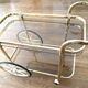 Brass and smoked glass bar trolley, 2 trays