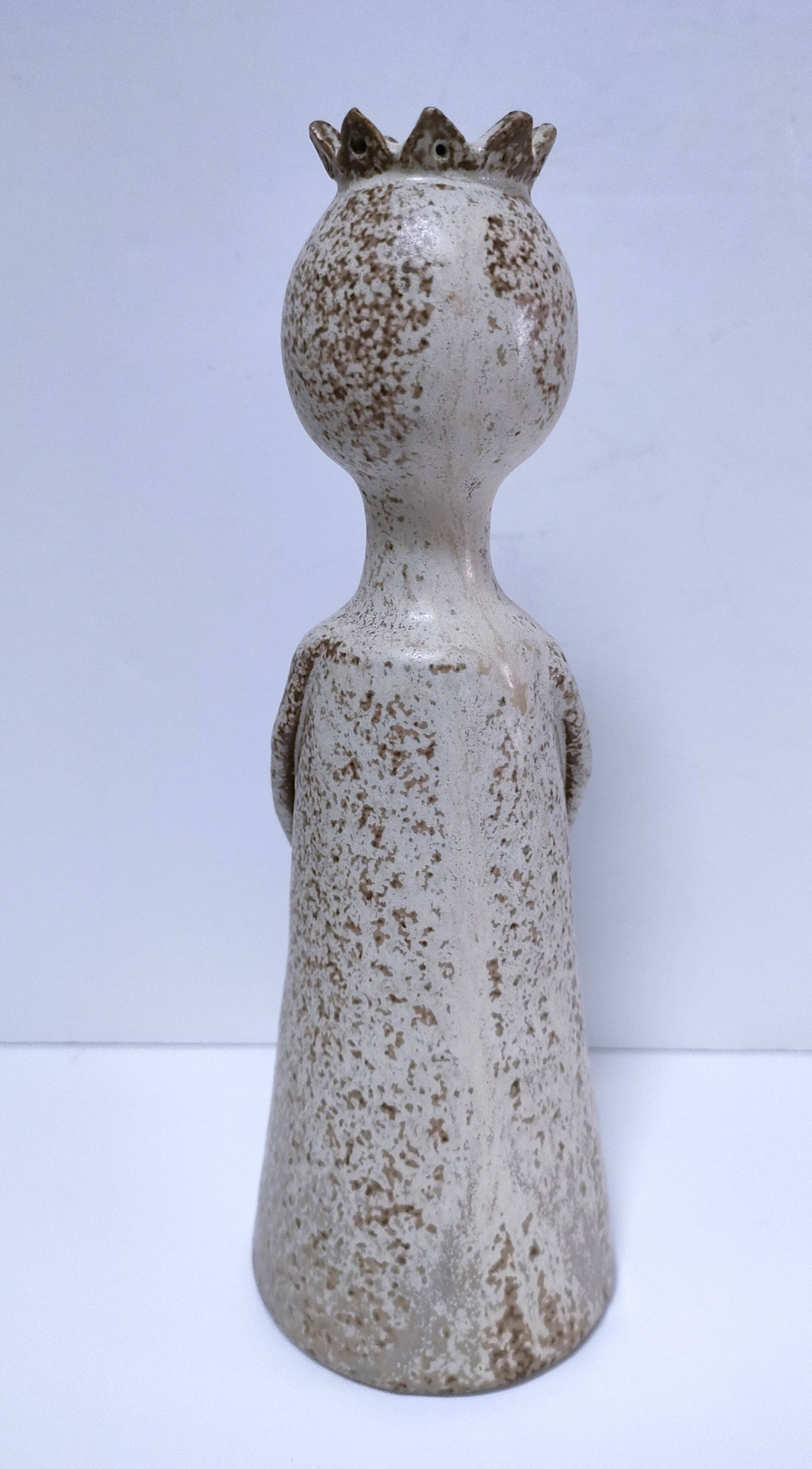 ceramic candle holder with crowned head signed P