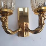 Golden bronze wall lamp with mermaids for an old bathroom.
